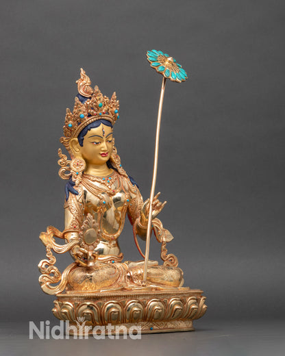 Side view Dukar statue holding white parasol umbrella and Dharma Wheel gold art