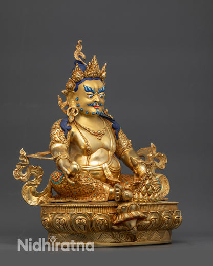 Side view Dzambhala seated on lotus in royal ease pose with foot near shell
