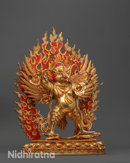 Side view Garuda Dev Statue holding serpent cruising atop subdued evil deities
