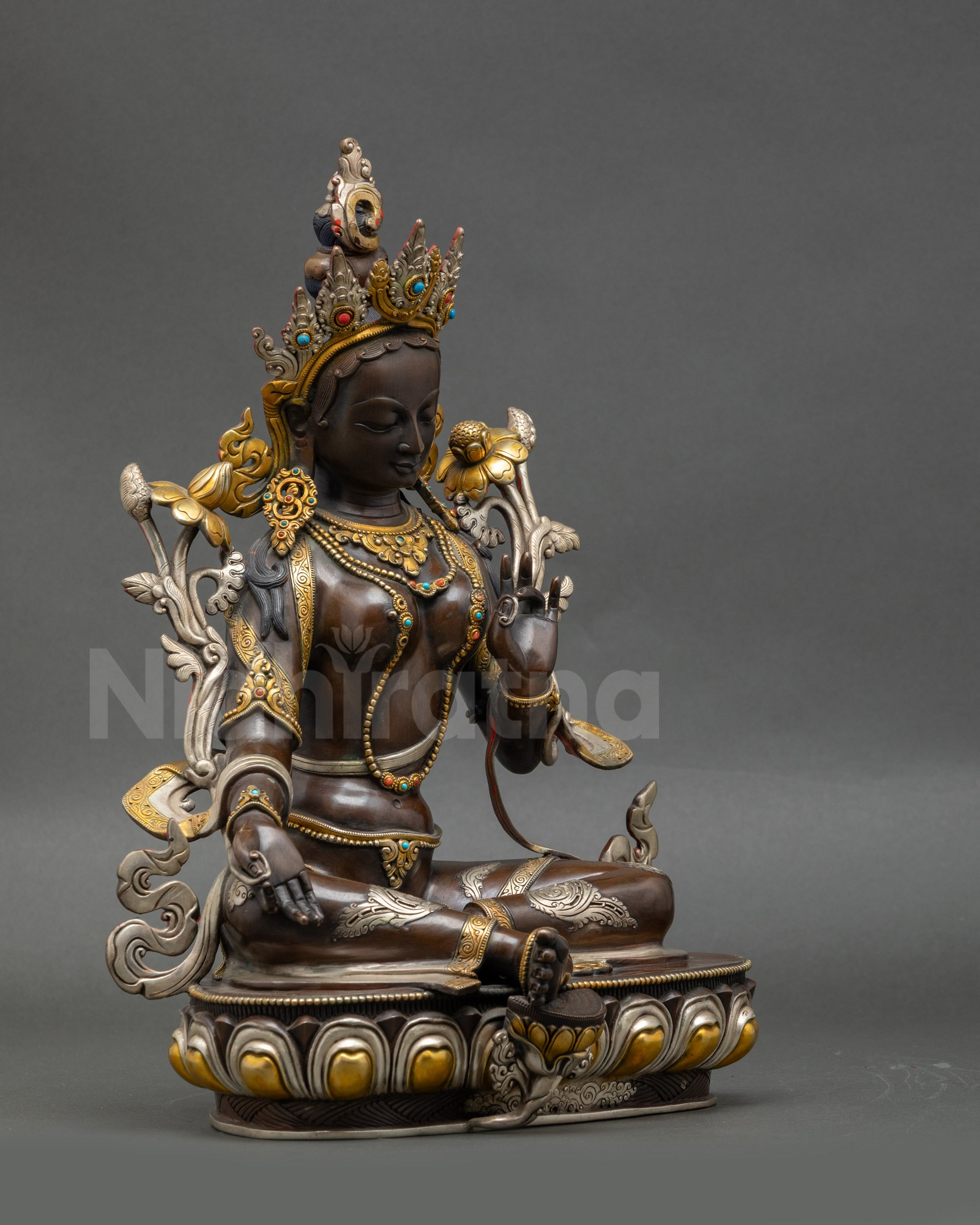 Side view Green Tara Buddha statue | Chemically oxidized copper figurine in serene posture