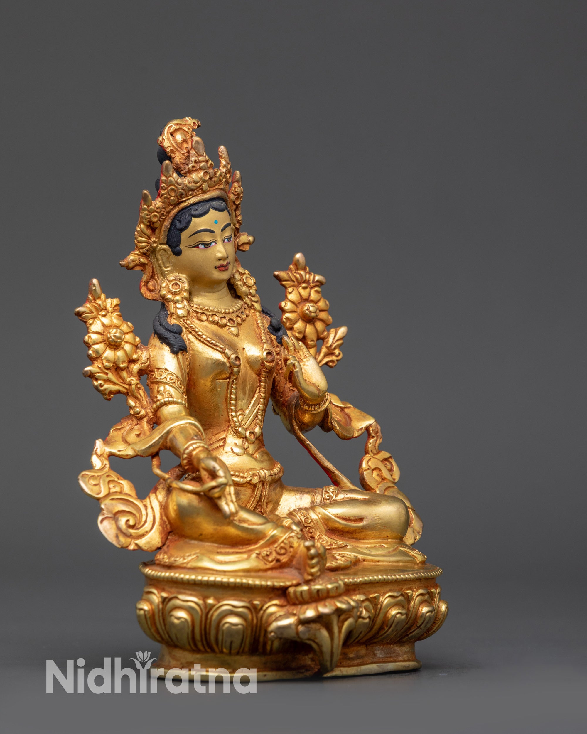 Side view Green Tara Statue Nepalese artwork showing varada and abhaya mudras