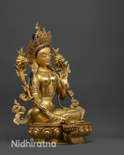 Side view Green Tara Statue holding Utpala flower with Varada and Vitarka mudras
