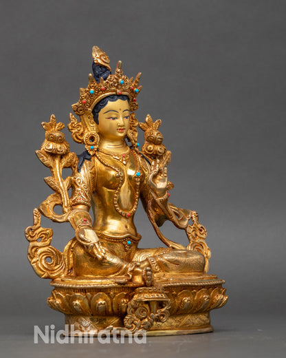 Side view Green Tara Statue – seated on lotus throne with right leg forward on lotus
