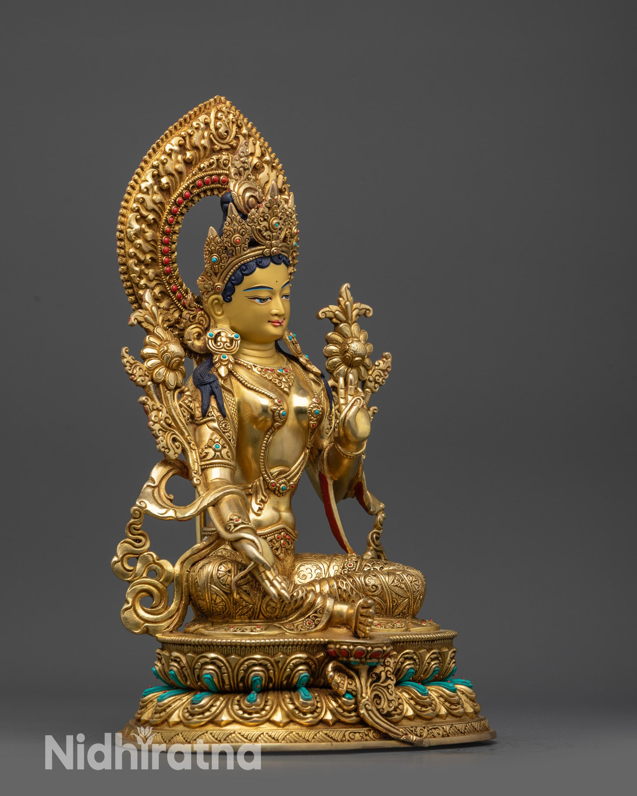 Side view Green Tara Statue with blue lotus and gold-gilded flowing robes craftsmanship