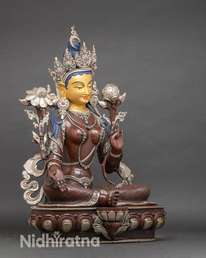 Side view Green Tara seated on lotus pedestal with Varada and Abhaya Mudra