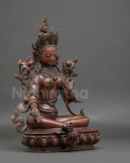 Side view Green Tara statue | Seated on lotus with flowing silk garments and serene posture