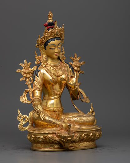 Side view Green Tara statue with Varada and Vitarka mudras, flowing robes, hand-carved Newari copper sculpture