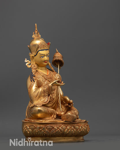 Side view Guru Norlha statue semi-wrathful expression with mongoose and ornate robe