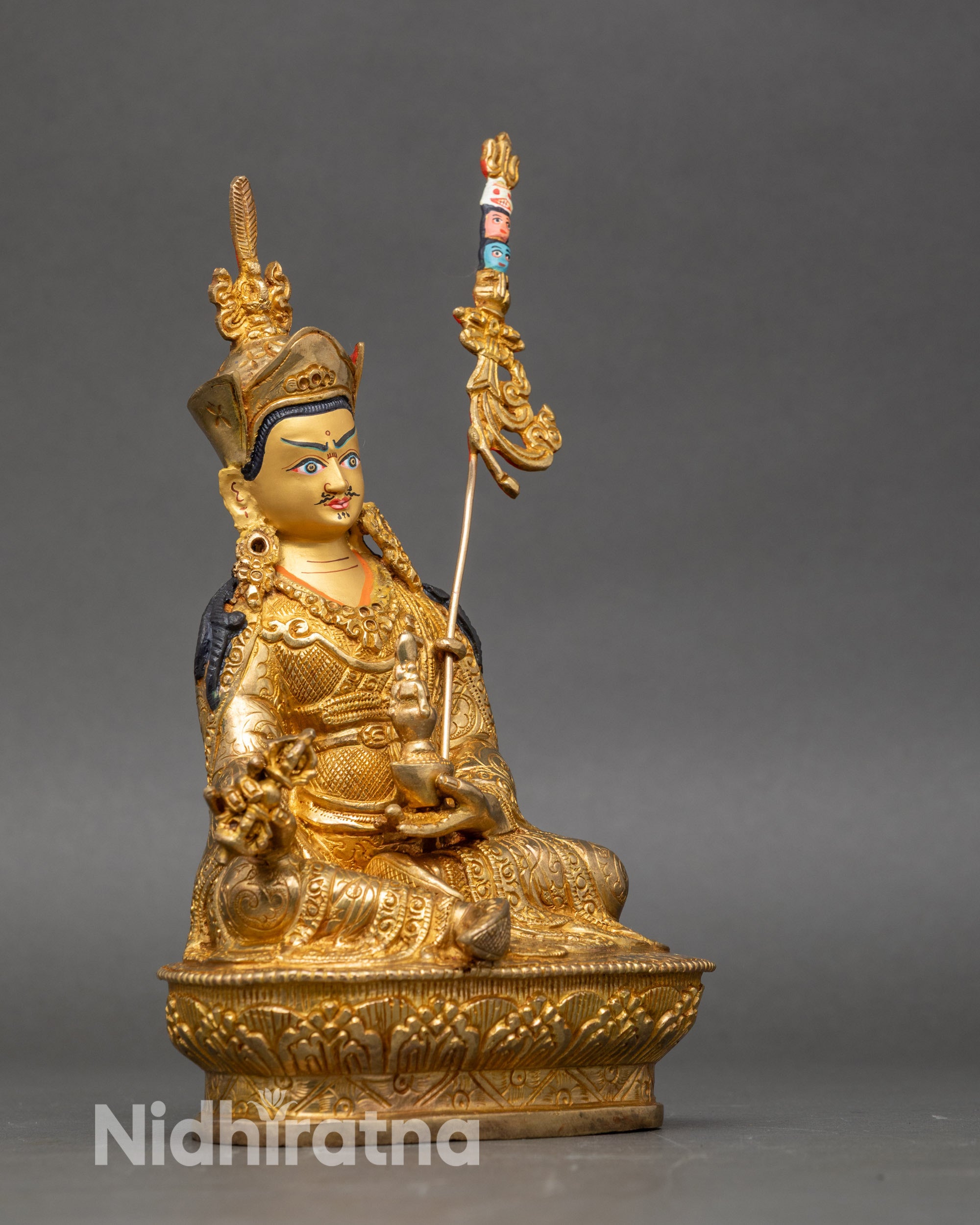 Side view Guru Rinpoche Statue – seated in royal ease with intricate Himalayan details