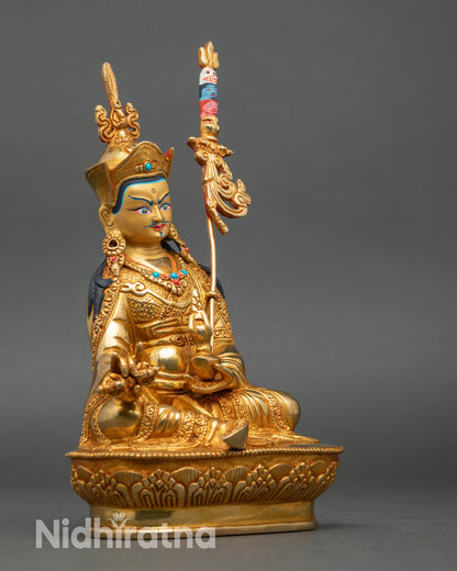 Side view Guru Rinpoche seated on lotus throne holding a kalash and dorje