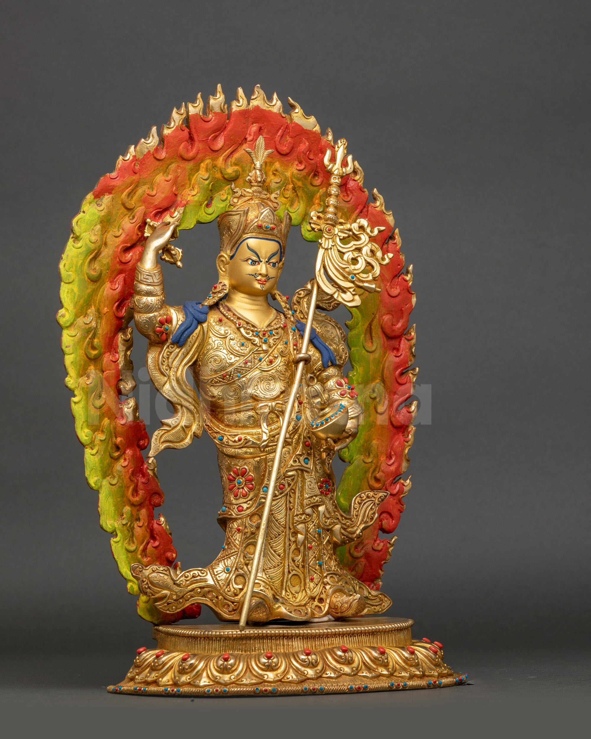 Side view Guru Rinpoche statue holding vajra and khatvanga, coral turquoise inlay