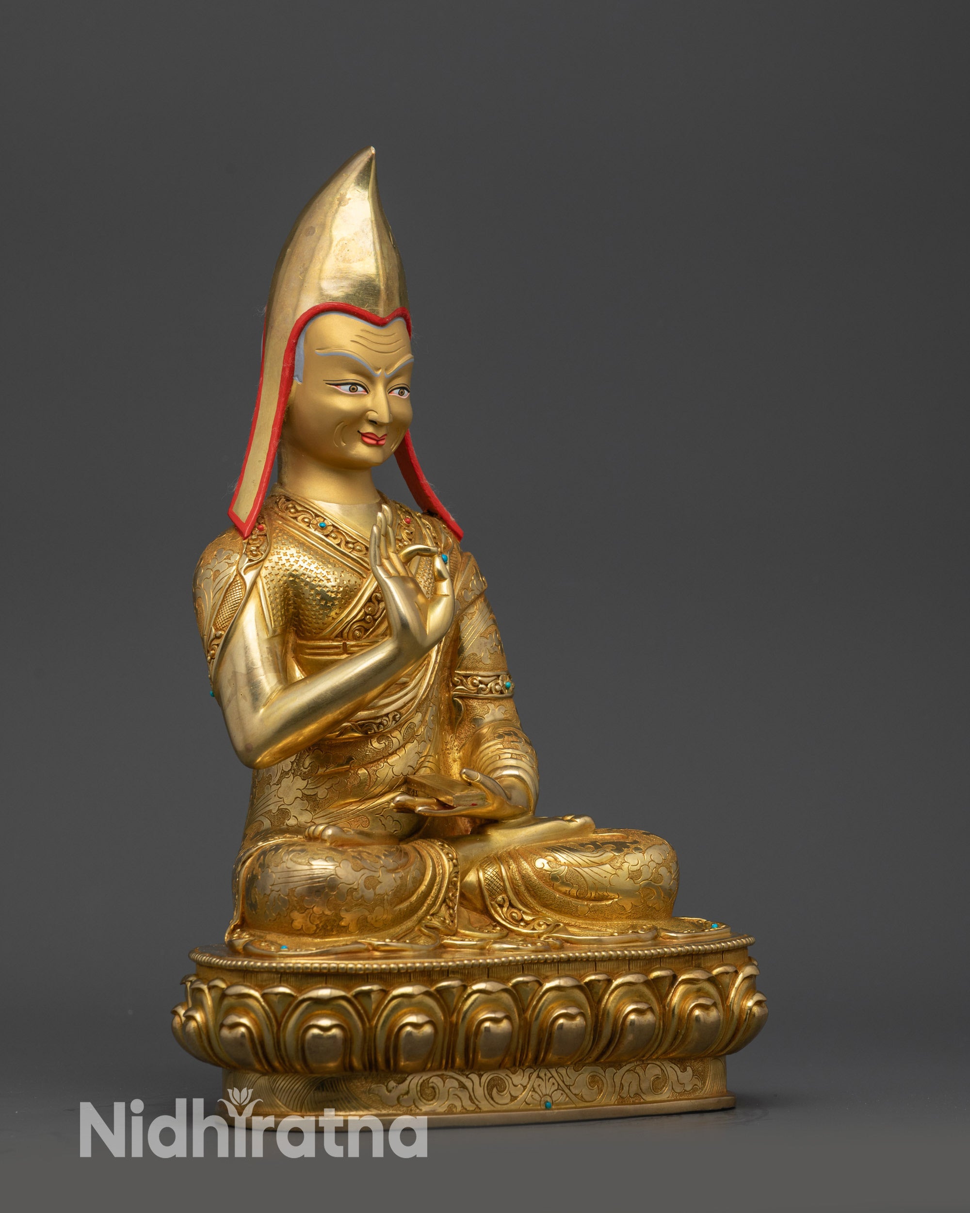 Side view Gyaltsab statue on lotus seat with Vitarka Mudra and yellow Pandita Hat
