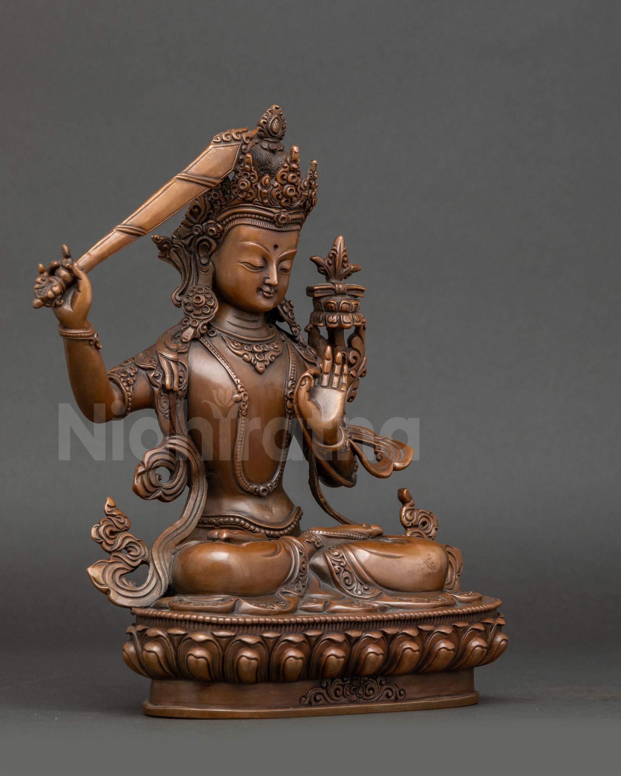 Side view – Handcrafted Himalayan Manjushri Bodhisattva statue with lotus seat, flaming sword, and Prajnaparamita Sutra, oxidized copper Nepalese art.