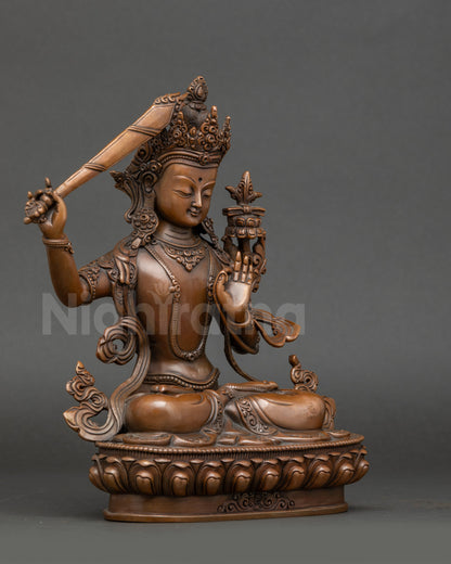 Side view – Handcrafted Himalayan Manjushri Bodhisattva statue with lotus seat, flaming sword, and Prajnaparamita Sutra, oxidized copper Nepalese art.