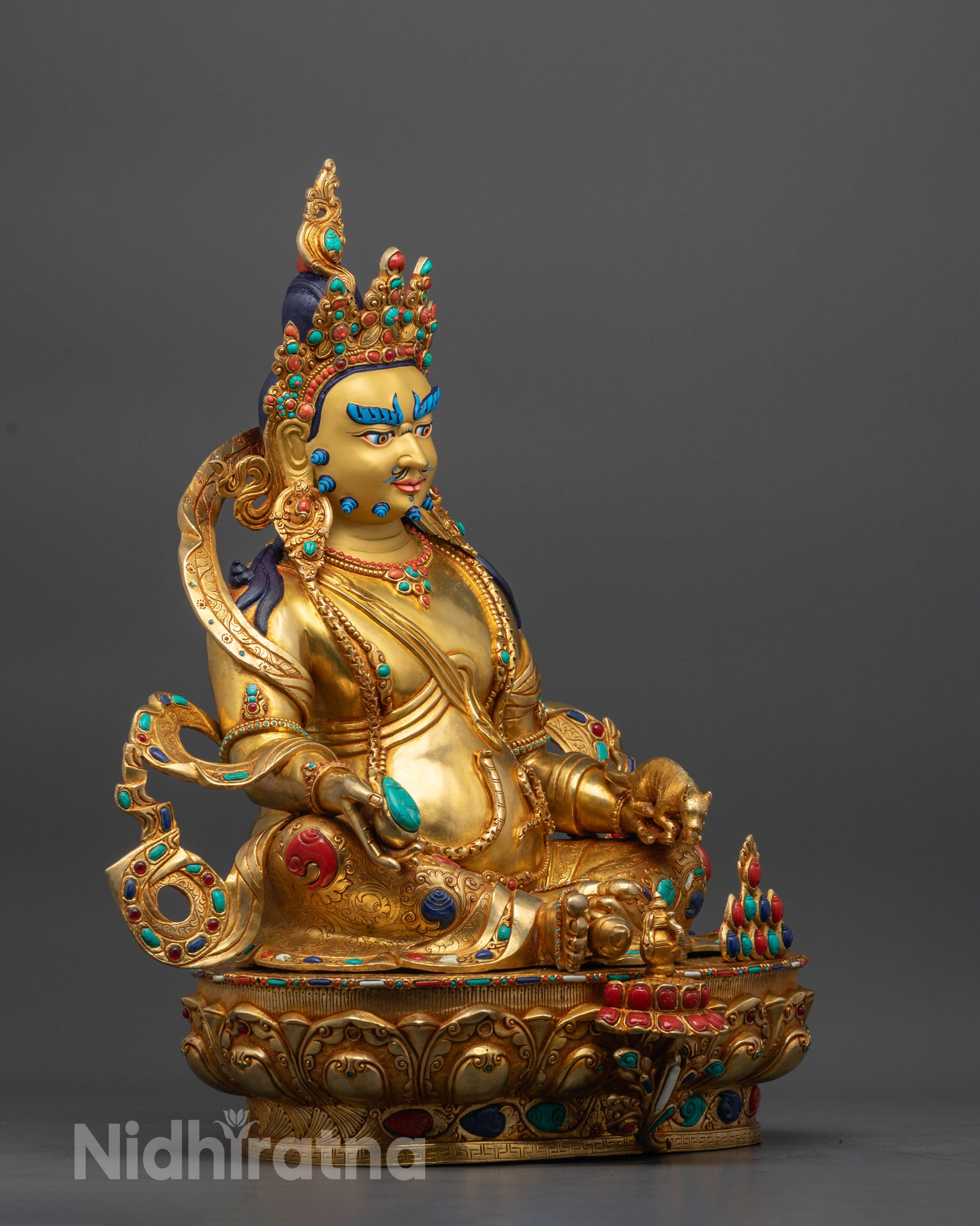 Side view Jambhala Statue holding mongoose spitting precious jewels