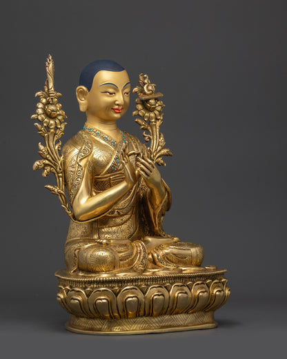 Side view Je Tsongkhapa statue showing gold fire-gilded body and intricate robe carvings