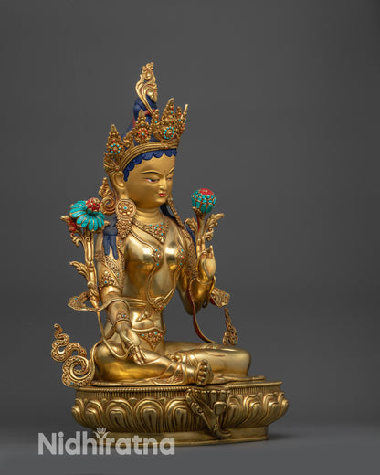 Side view Jetsun Drolma Statue highlighting flowing robe, Vitarka Mudra, and lotus stem