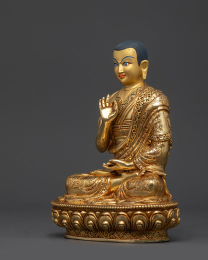 Side view Khedrup Je statue with finely engraved monastic robes
