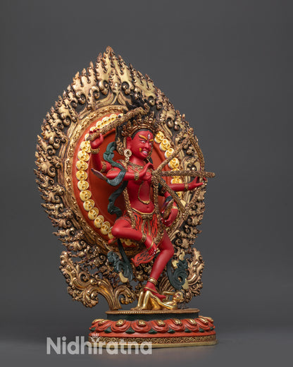 Side view Kurukulla Statue with arrow, hook, noose, and blazing halo behind figure