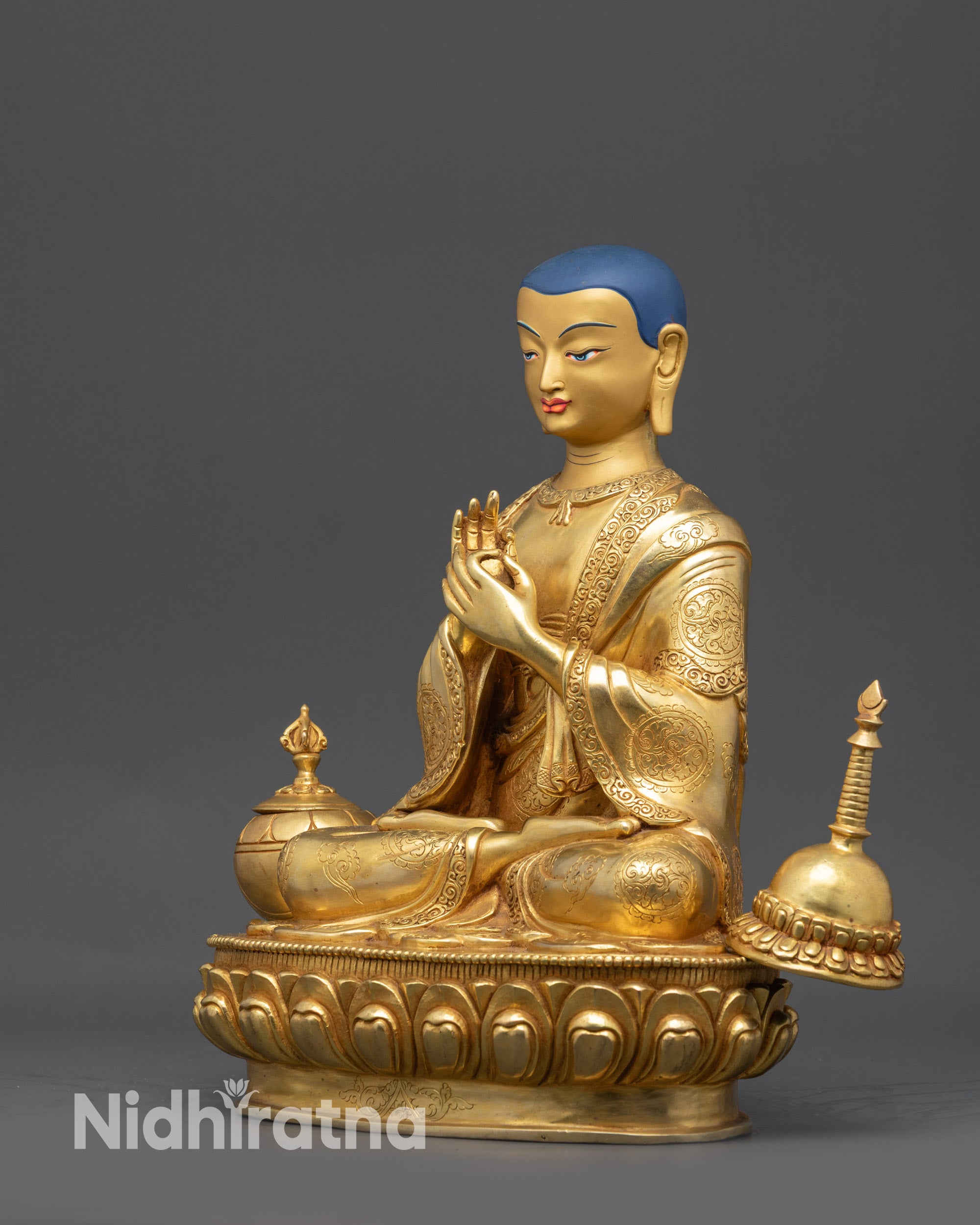 Side view Lama Atisa Statue showing intricate monk’s robe and religious patterns on garments
