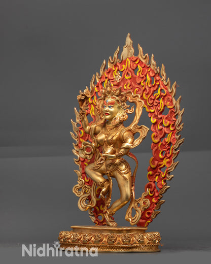 Side view Machig Labdron Statue holding hand drum and bell with floating robes visible
