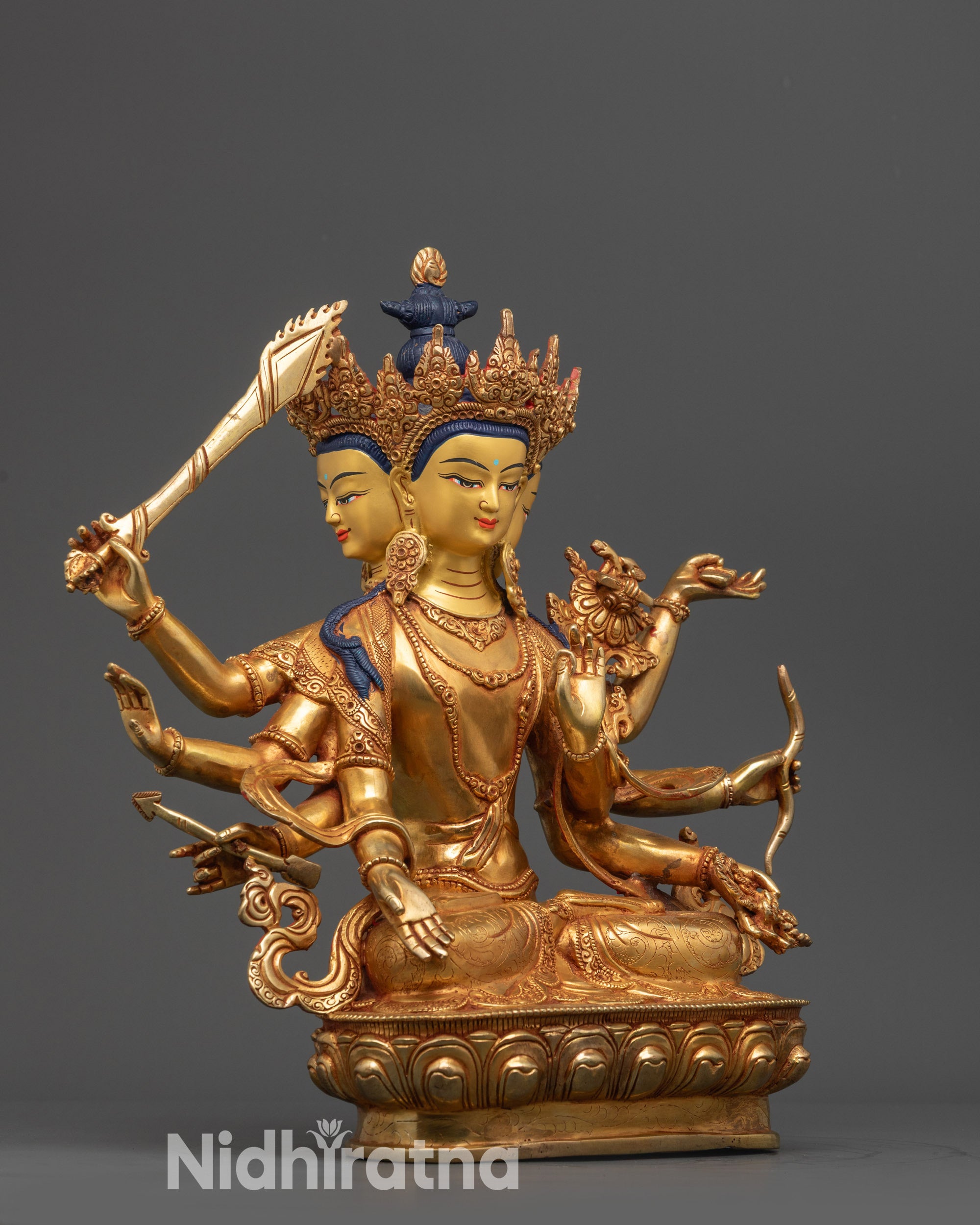 Side view Maha Manjushri Statue with flowing robes and intricately carved lower garments