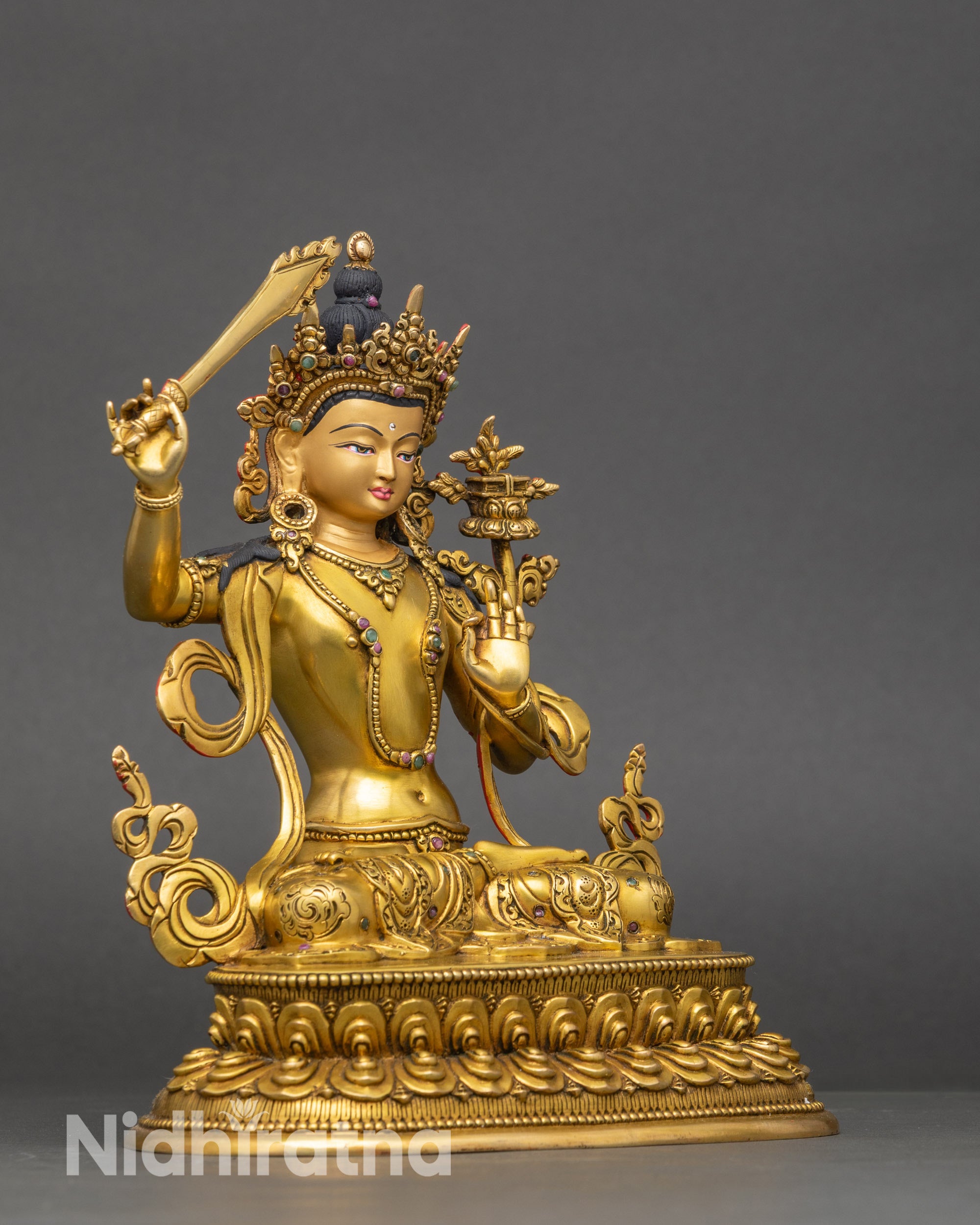 Side view Maha Manjushri statue four-armed lost wax cast Nepalese Buddhist sculpture