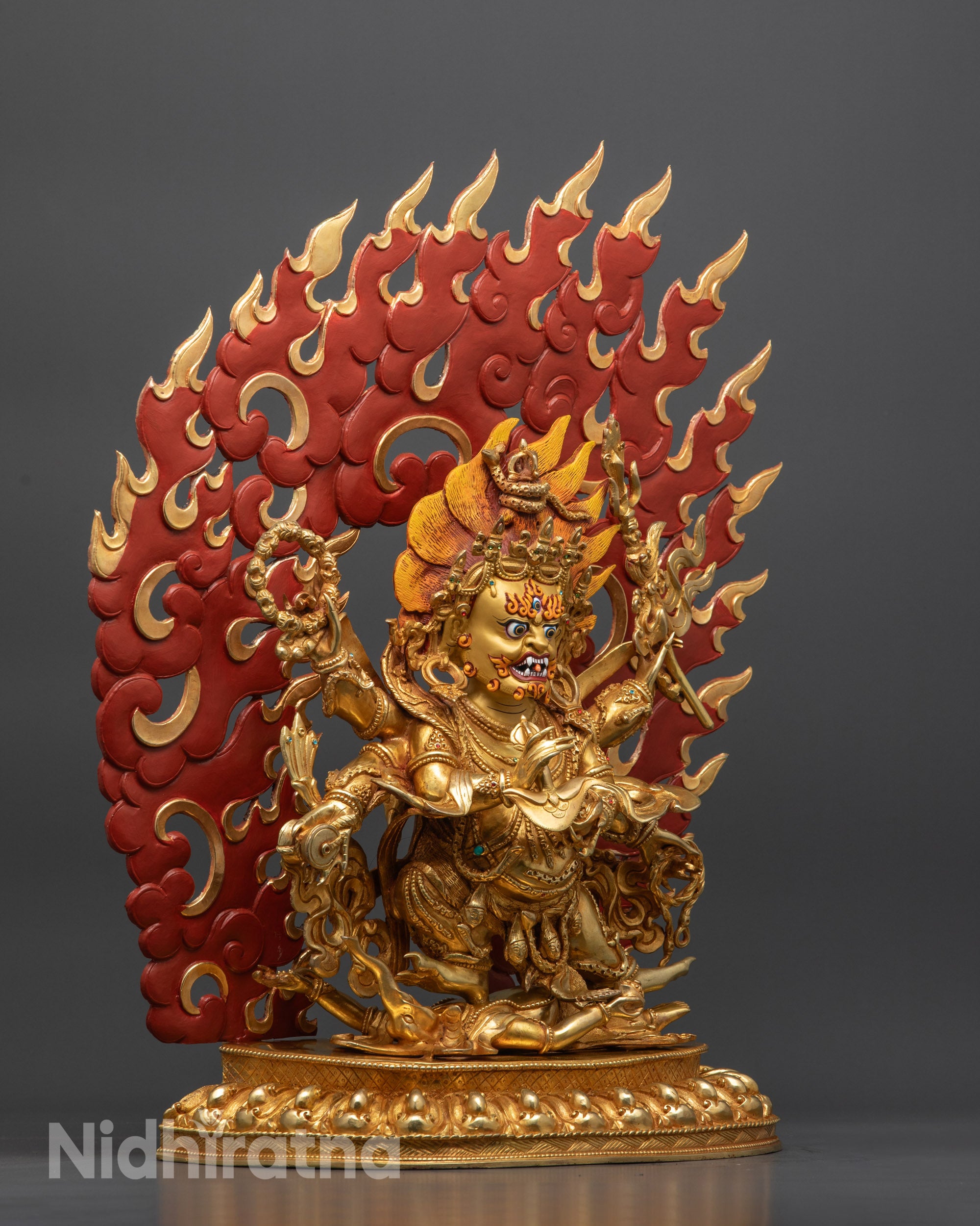 Side view Mahakala Statue showing intricate halo carvings and semi-precious stones
