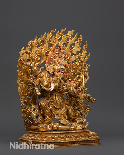 Side view Mahakala Statue showing six arms holding trident, kapala, and damaru