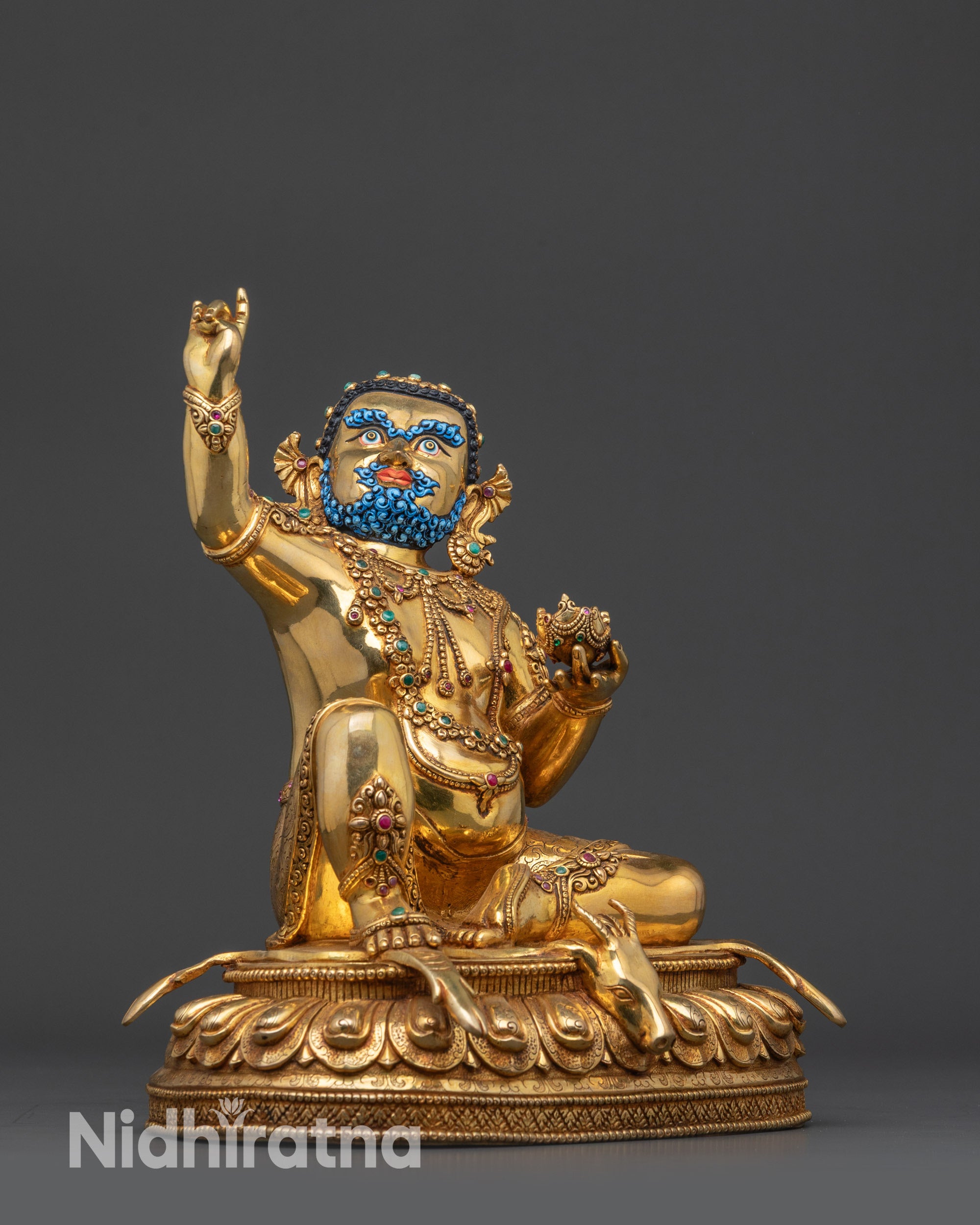 Side view Mahasiddha Virupa Tibetan sage statue seated on lotus with striped deer skin