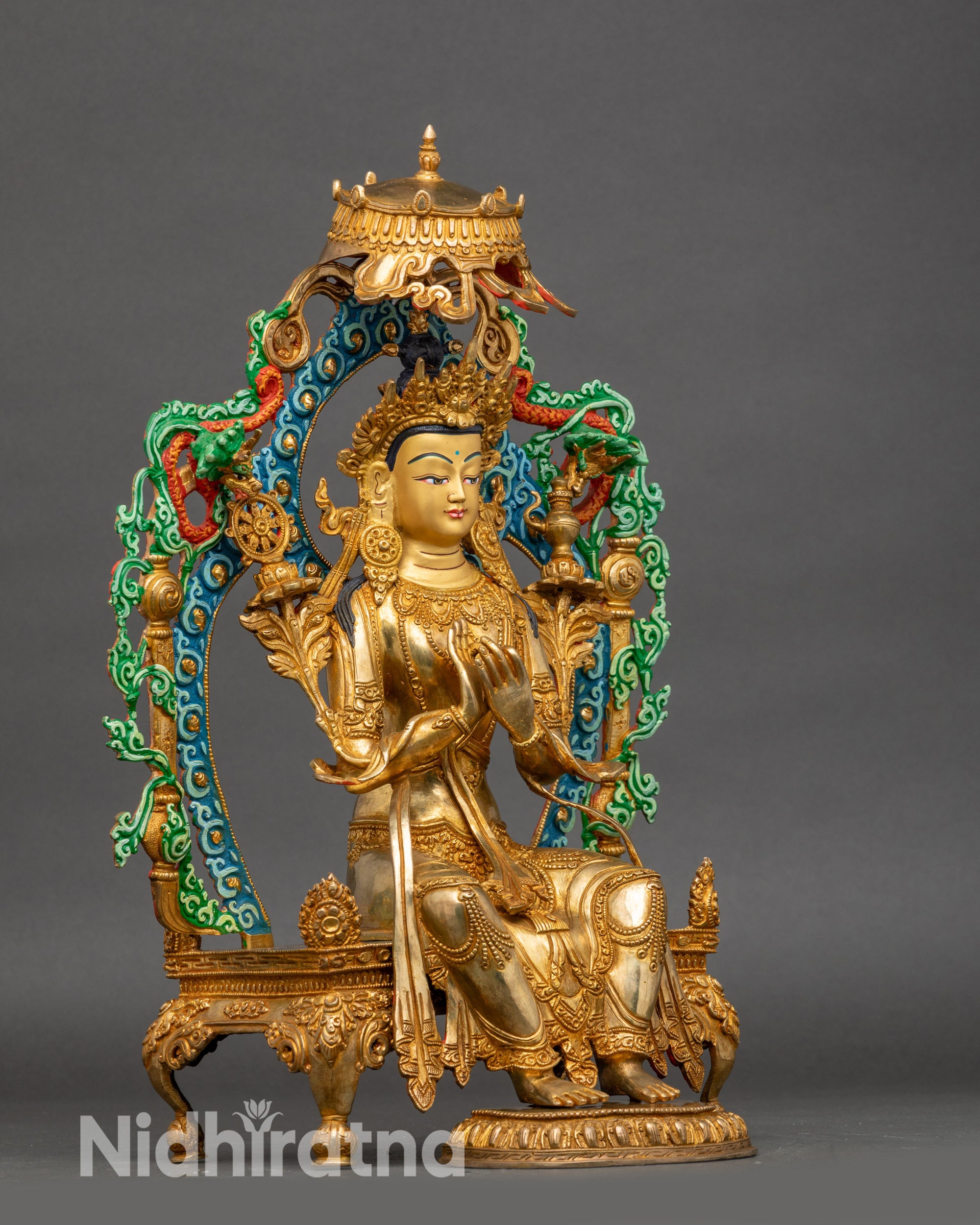 Side view Maitreya Buddha sculpture seated on throne with parasol umbrella and halo
