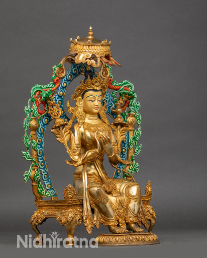 Side view Maitreya Buddha sculpture seated on throne with parasol umbrella and halo