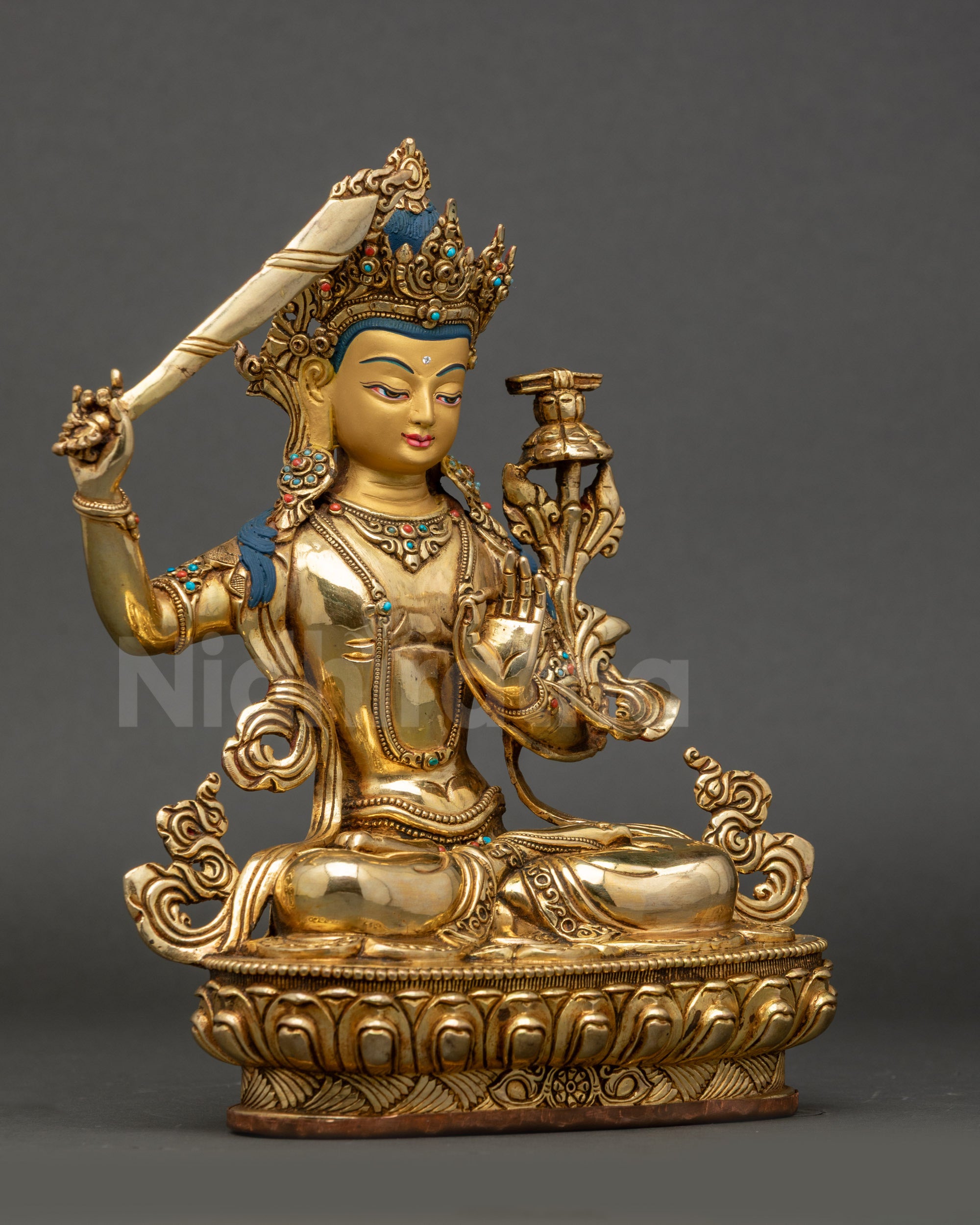 Side view Manjushree Bodhisattva Statue, seated on lotus throne in meditative mudra