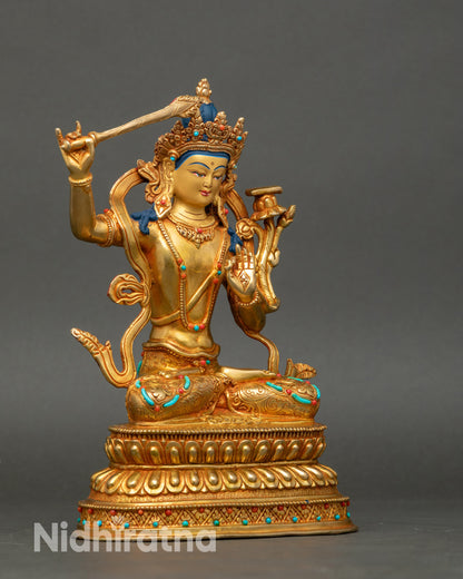 Side view Manjushree Bodhisattva statue seated on double lotus throne with stone decor