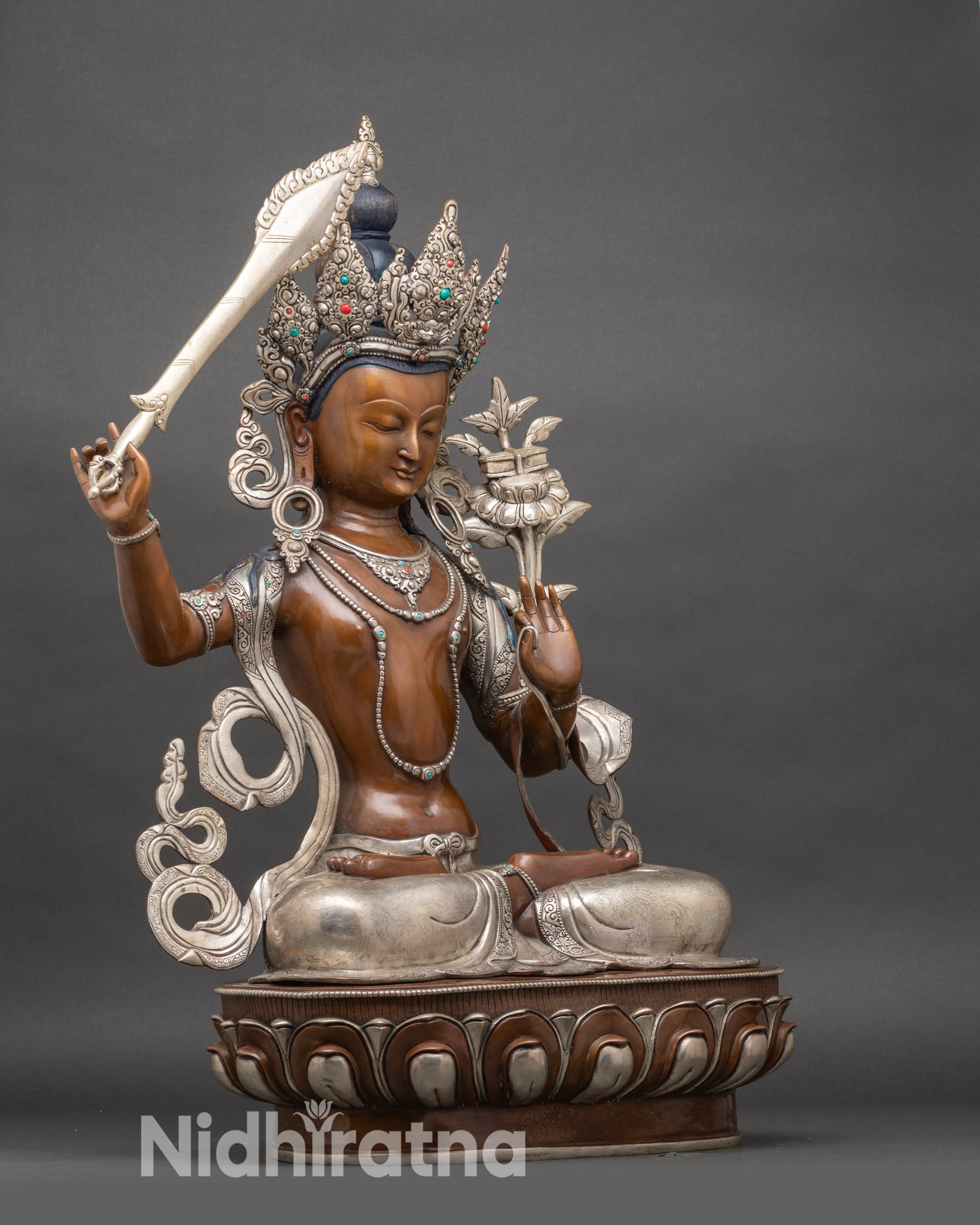 Side view Manjushree Bodhisattva statue with Prajnaparamita Sutra and engraved lotus pedestal