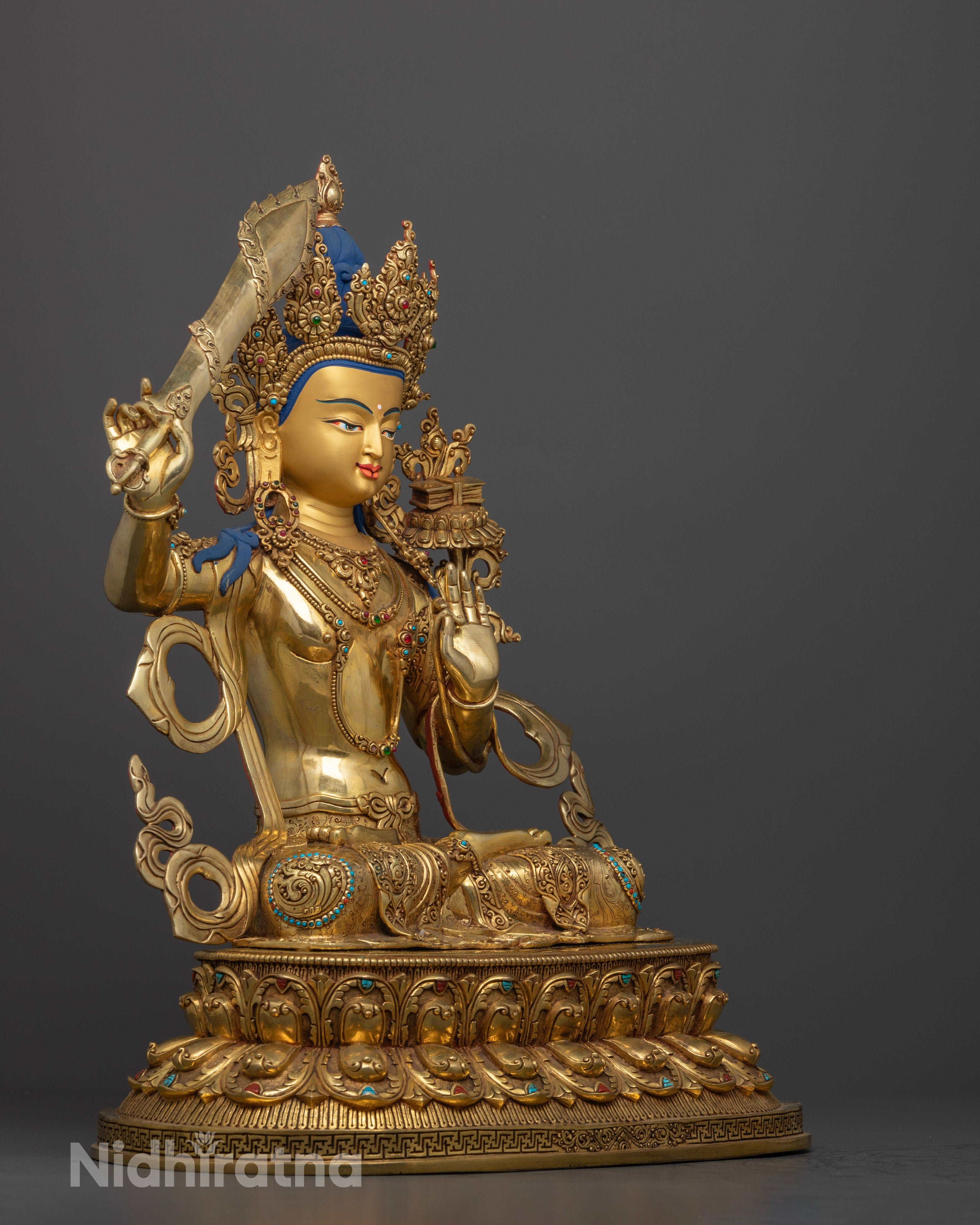 Side view Manjushri Bodhisattva sculpture copper robes intricate Newari artisan Nepal