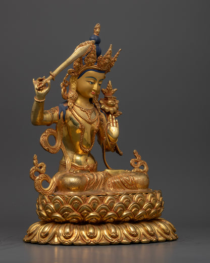 Side view Manjushri seated on lotus pedestal with detailed floral robes, copper Buddhist statue from Nepal