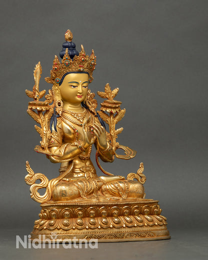 Side view Manjushri statue highlighting double lotus throne, flowing robes, and sacred carvings