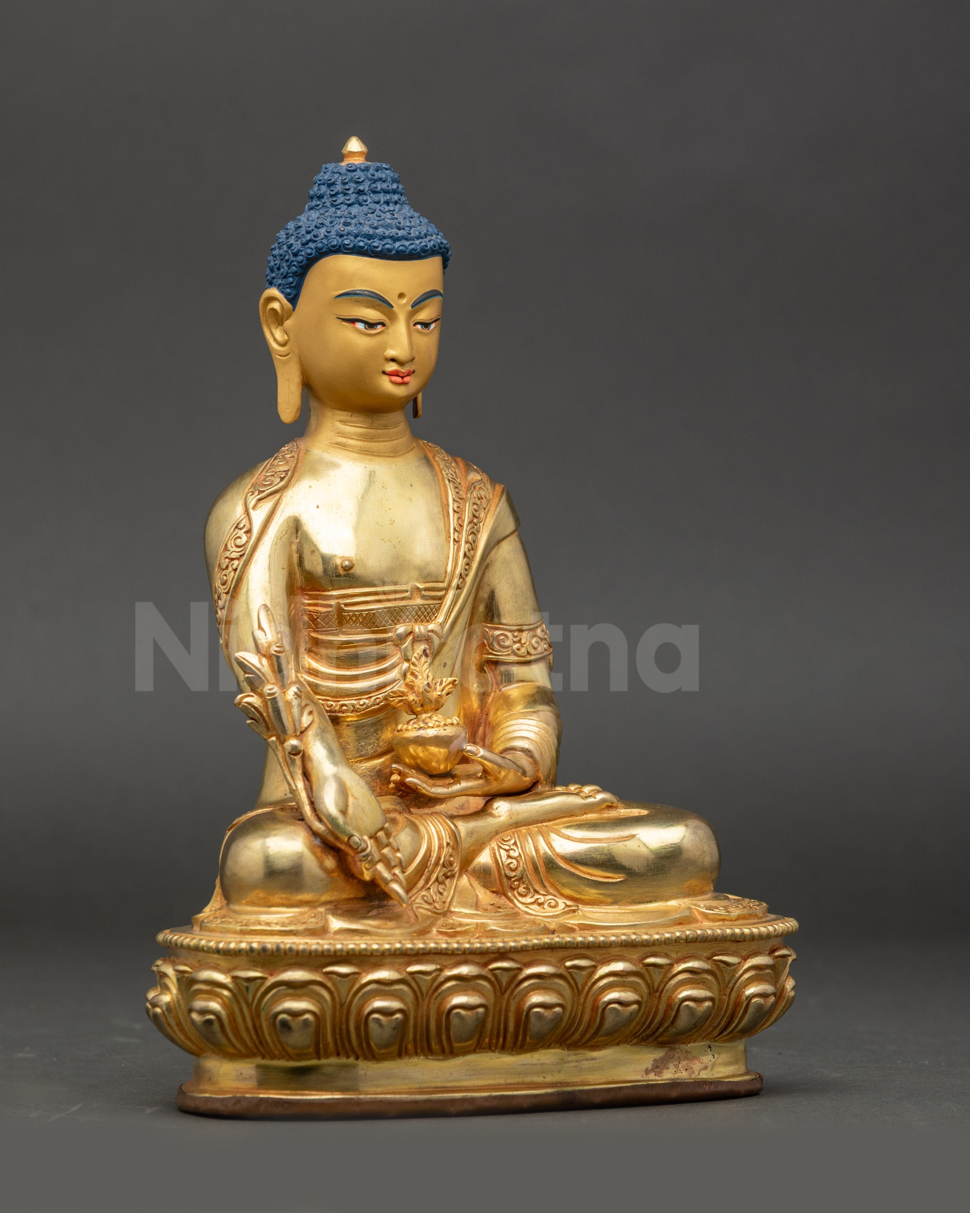 Side view Medicine Buddha – copper statue with radiant gold fire-gilding and lotus seat
