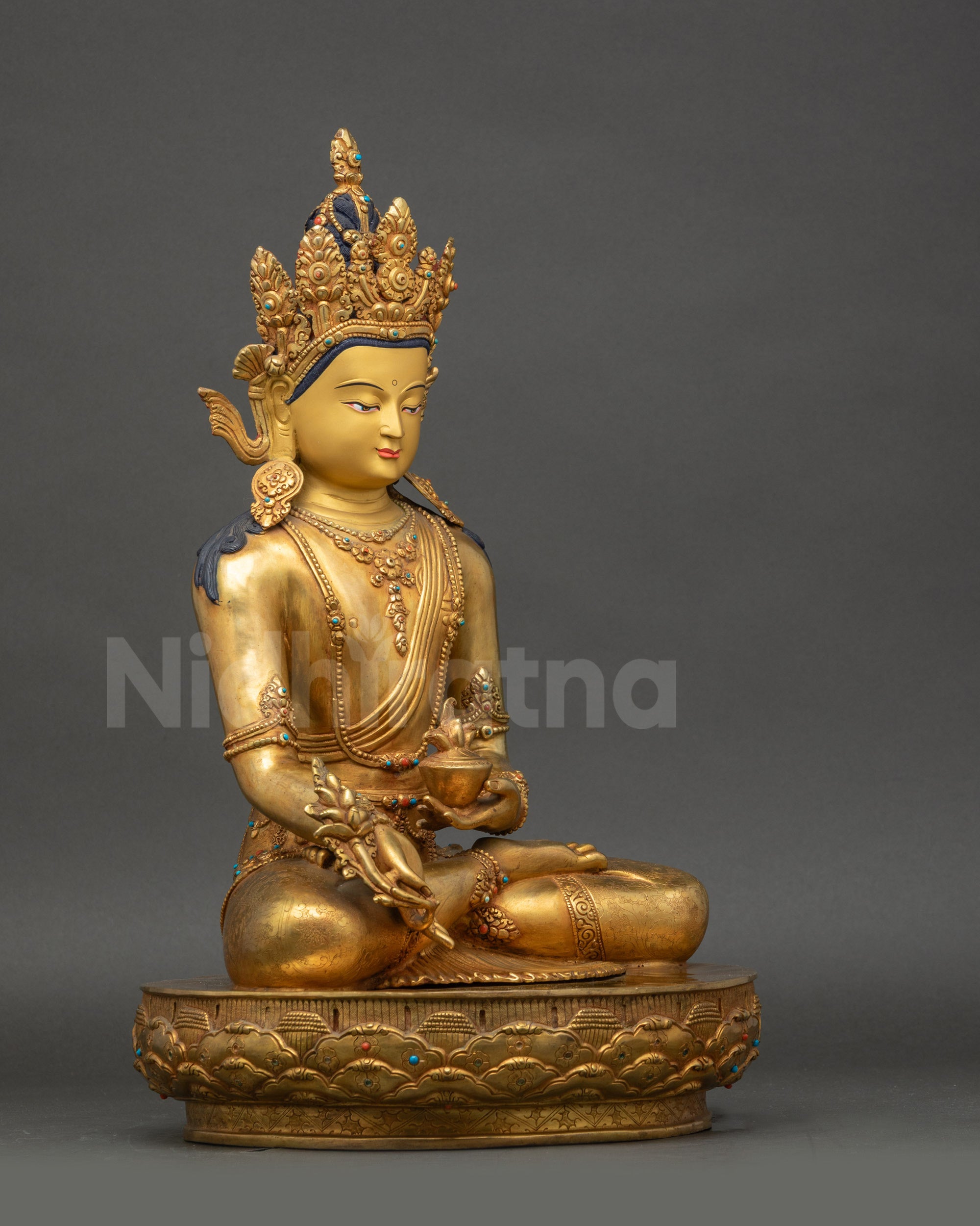 Side view Medicine Buddha holding myrobalan plant and medicine bowl, Vajra posture