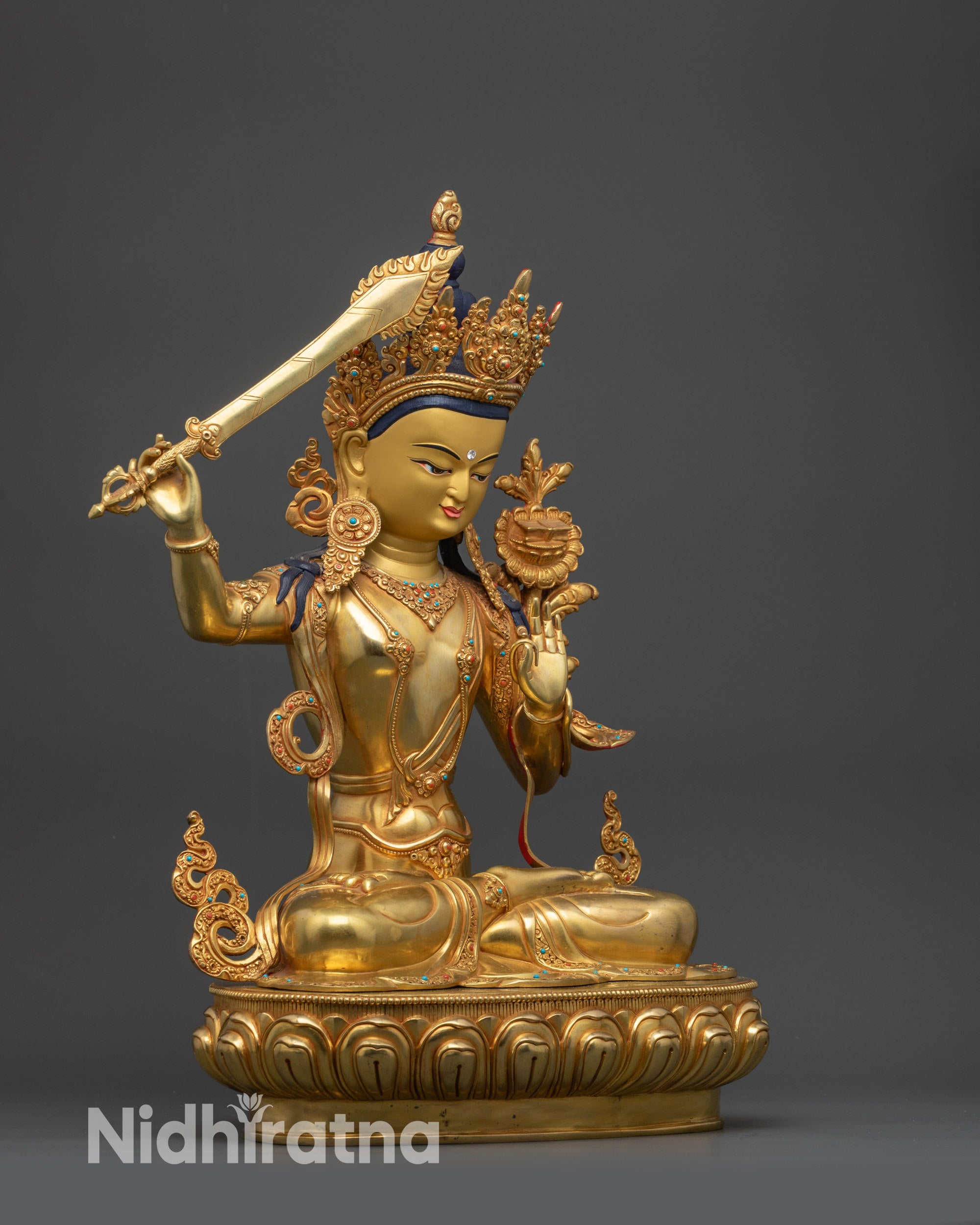 Side view Monju Bosatsu Statue highlighting Abhaya Mudra and detailed sword carvings