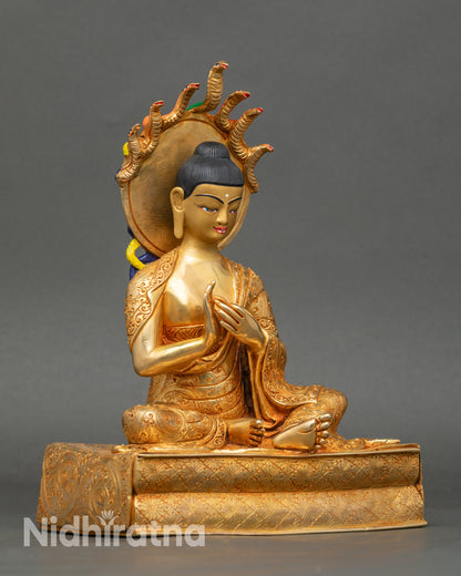 Side view Nagarjun meditative statue seated on carved throne gold copper Nepal