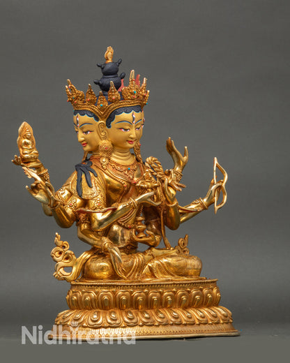 Side view Namgyalma holding double dorje vase, bow and arrow, lotus seat