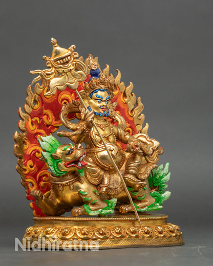 Side view Namtoshe Statue – seated on snow lion throne with victory banner and mongoose