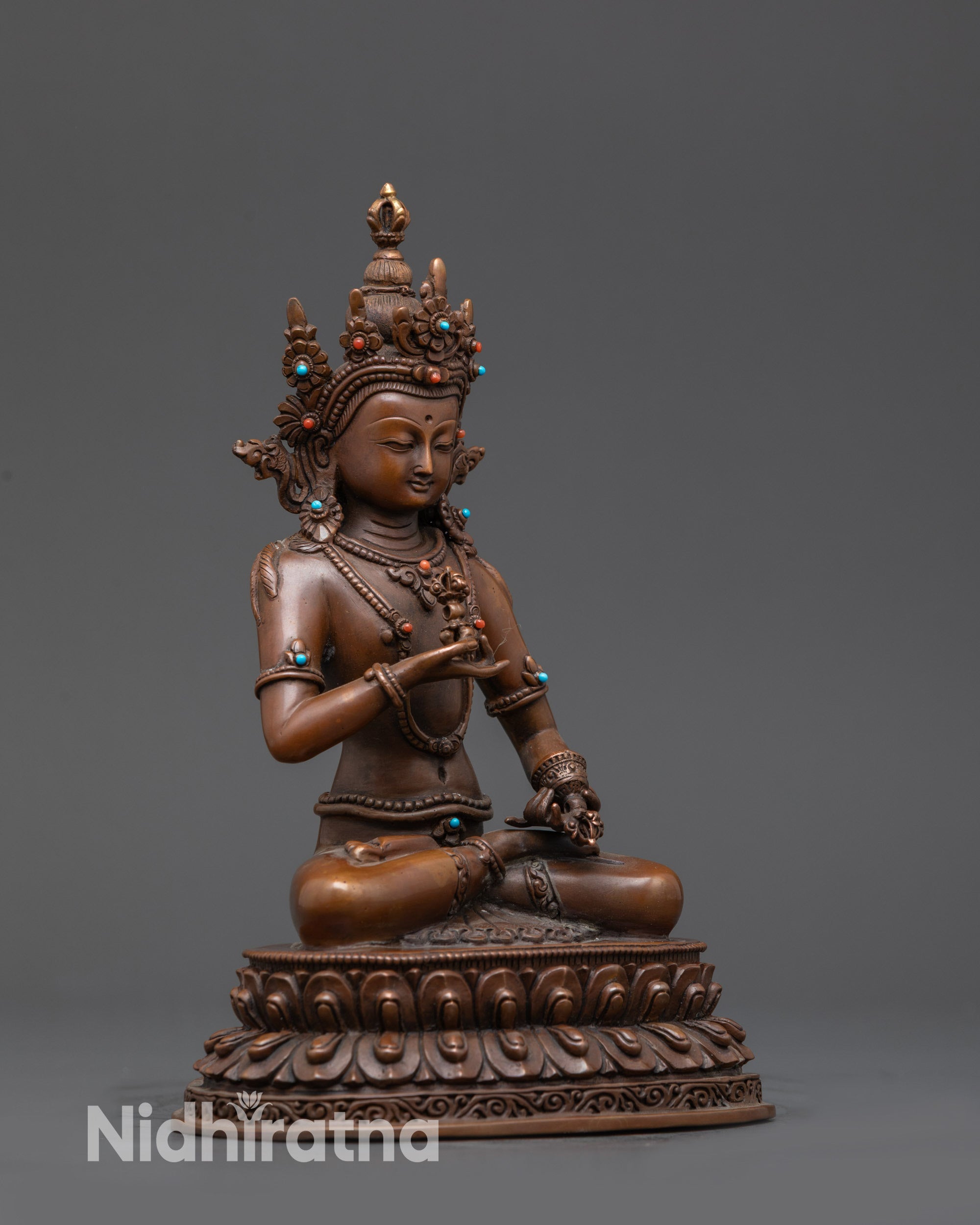 Side view Oxidized Dorje Sempa Statue seated in meditative posture with tranquil expression