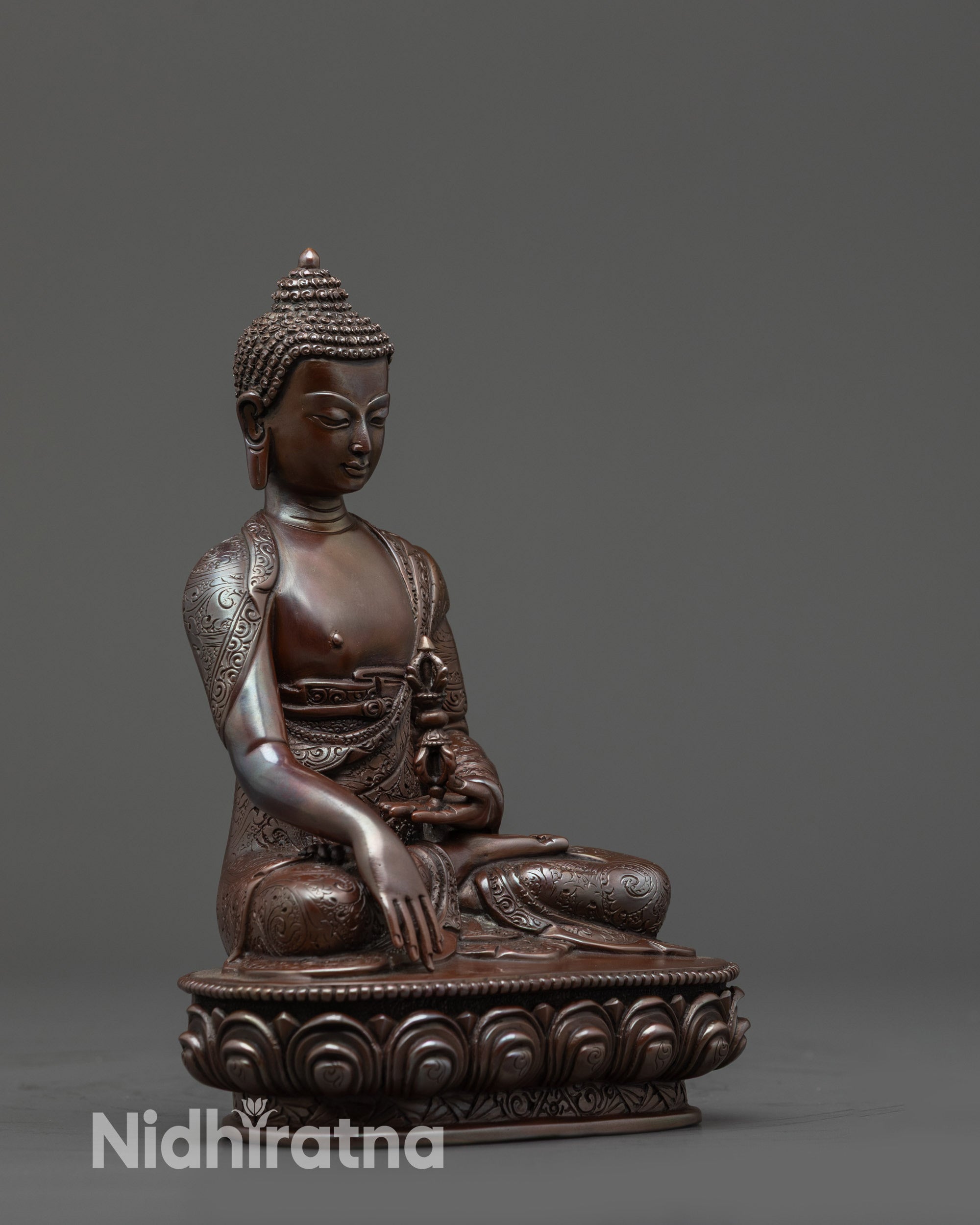 Side view Oxidized Mitrugpa Statue showing monk’s robe and vajra in left hand