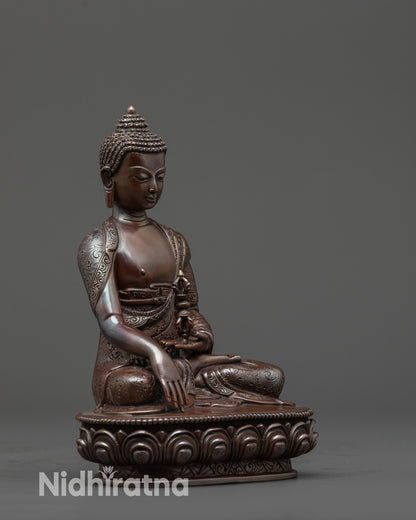 Side view Oxidized Mitrugpa Statue showing monk’s robe and vajra in left hand