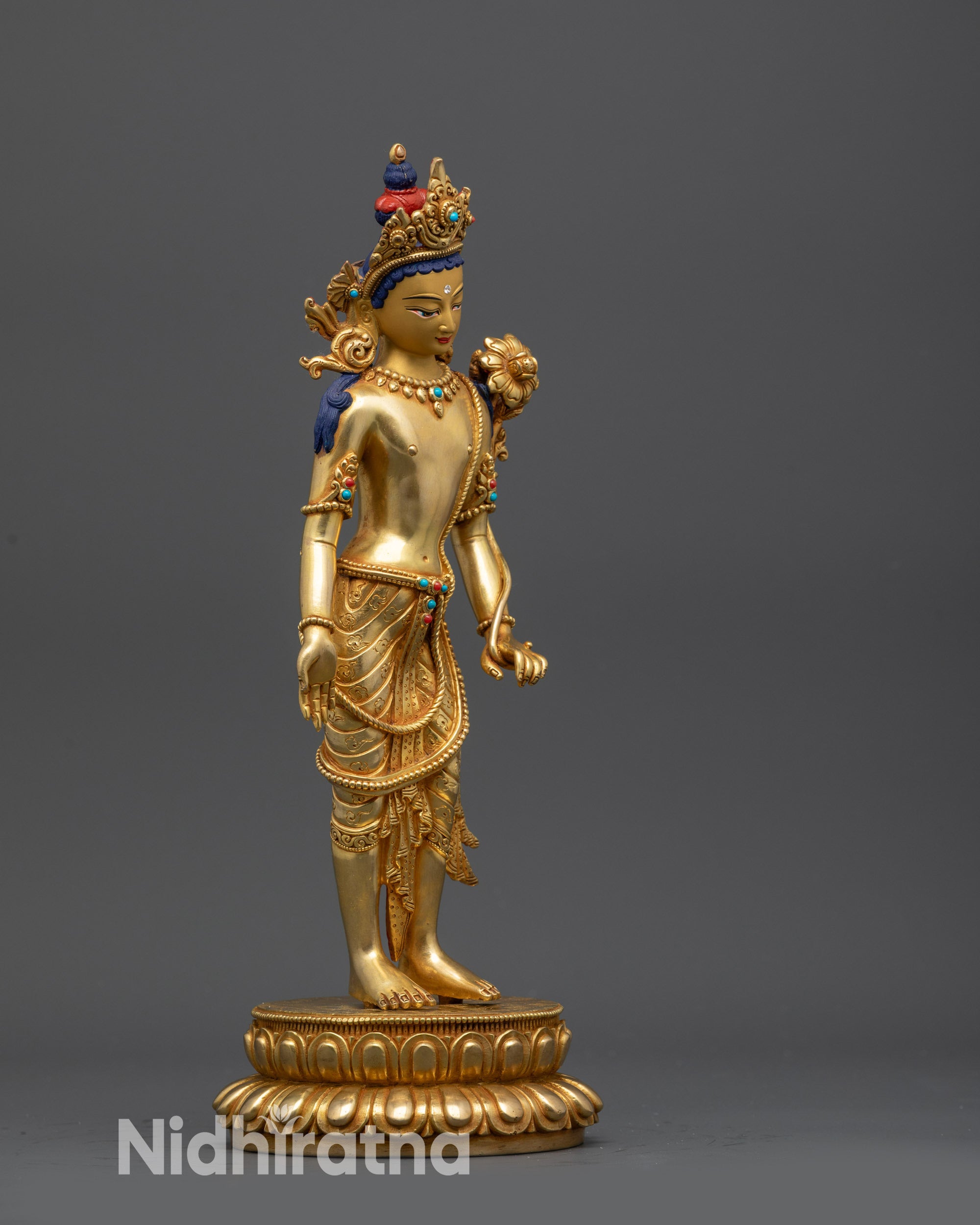 Side view Padmapani statue on gold fire-gilded base showing graceful stance
