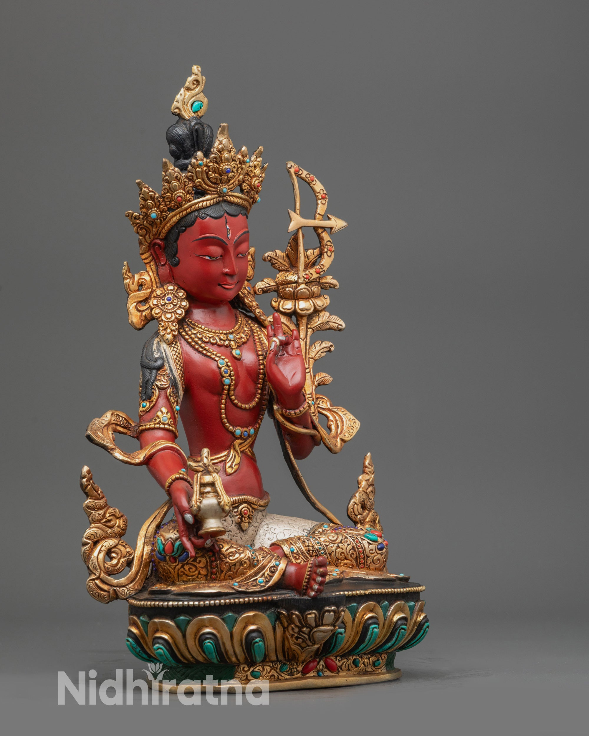 Side view Red Tara Statue holding utpala stem and vase with lotus flower beside shoulder