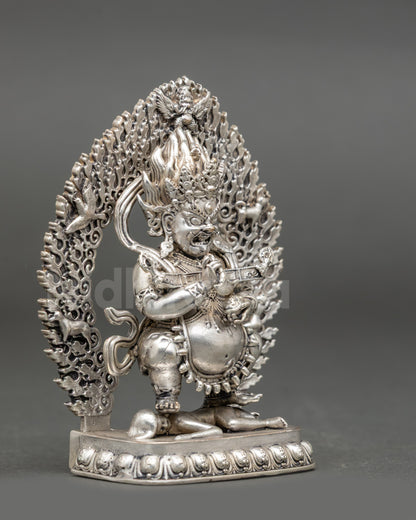 Side view Sakya Mahakala statue holding kartika and kapala, wrathful protector deity